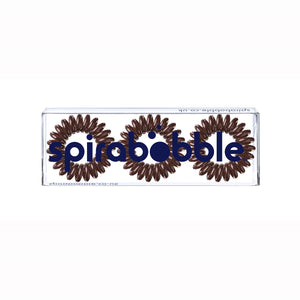 A flat transparent box of 3 brown sugar coloured hair accessories called spirabobbles