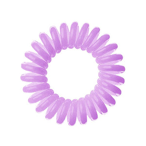 A purple coloured plastic spiral circular hair bobble on a white background called a spirabobble