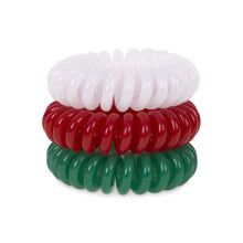 Load image into Gallery viewer, A tower of three (placed on top of each other) of white, red and green coloured plastic spiral circular hair bobbles on a white background that looks like an old fashioned curly coiled telephone cable or a coiled spring which has been made into a circular
