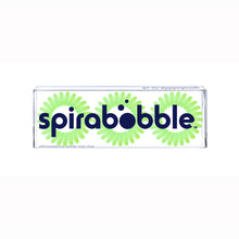Load image into Gallery viewer, A flat transparent box of 3 apple pie green coloured hair accessories called SpiraBobbles
