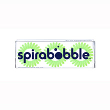 Load image into Gallery viewer, A flat transparent box of 3 apple pie green coloured hair accessories called SpiraBobbles