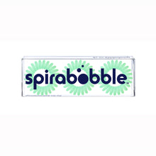 Load image into Gallery viewer, A flat transparent box containing 3 aqua green spirabobbles