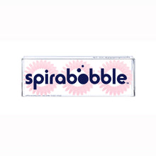 Load image into Gallery viewer, A flat transparent box of 3 baby pink coloured hair accessories called spirabobble
