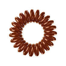 Load image into Gallery viewer, A cinnamon bun brown coloured plastic spiral circular hair bobble on a white background called a spirabobble.
