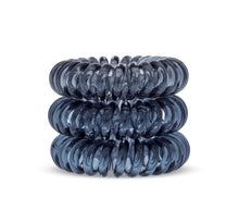 Load image into Gallery viewer, A tower of 3 black coloured hair bobbles called spirabobbles. A clear black plastic spiral circular hair tie spira bobble.
