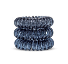 Load image into Gallery viewer, A tower of 3 black coloured hair bobbles called spirabobbles. A clear black plastic spiral circular hair tie spira bobble.