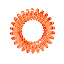 Load image into Gallery viewer, A orange segment coloured plastic spiral circular hair bobble on a white background called a spirabobble.
