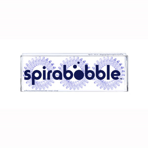 A flat transparent box of 3 pale purple coloured hair accessories called spirabobbles