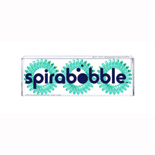 Load image into Gallery viewer, A flat transparent box of 3 serene green coloured hair accessories called spirabobbles