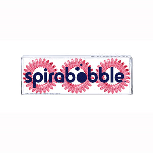 A flat transparent box of 3 simply cerise pink coloured hair accessories called spirabobbles