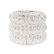Load image into Gallery viewer, A tower of 3 transparent clear coloured hair bobbles called spirabobbles. A clear plastic spiral circular hair tie spira bobble.