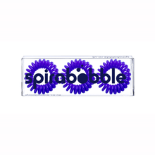 Load image into Gallery viewer, A flat transparent box of 3 purple coloured hair accessories called spirabobbles