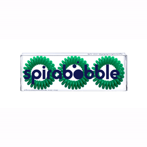 A flat transparent box of 3 green dream coloured hair accessories called spirabobble
