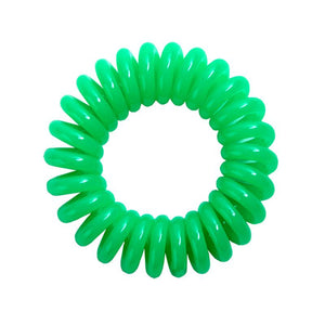A lime green coloured plastic spiral circular hair bobble on a white background called a spirabobble.