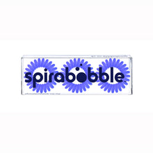 Load image into Gallery viewer, A flat transparent box of 3 purple power violet coloured hair accessories called spirabobbles
