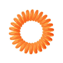 Load image into Gallery viewer, An orange coloured plastic spiral circular hair bobble on a white background called a spirabobble.
