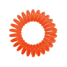 Load image into Gallery viewer, A bright orange coloured plastic spiral circular hair bobble on a white background called a spirabobble.
