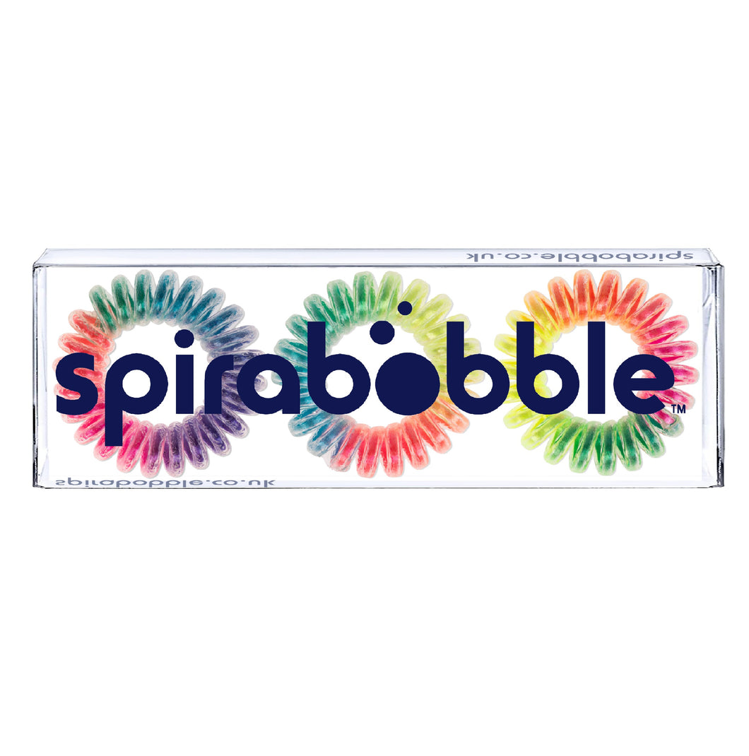 A flat transparent box of 3 rainbow coloured hair accessories called spirabobbles