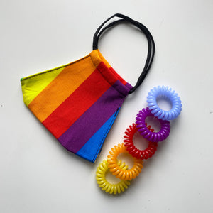 Different coloured spirabobbles which match the rainbow colours in the face mask