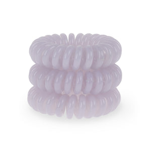 Tower of 3 light grey coloured spiral hair bobbles