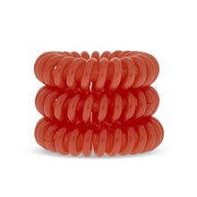 Load image into Gallery viewer, A tower of 3 bright oramge coloured hair bobbles called spirabobbles. A plastic spiral circular hair tie spira bobble.
