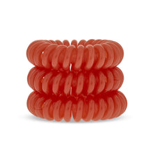 Load image into Gallery viewer, A tower of 3 bright oramge coloured hair bobbles called spirabobbles. A plastic spiral circular hair tie spira bobble.
