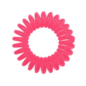 A rose pink coloured plastic spiral circular hair bobble on a white background called a spirabobble.