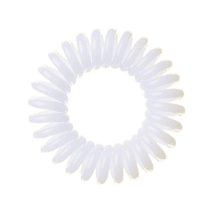 A snow white coloured plastic spiral circular hair bobble on a white background called a spirabobble.
