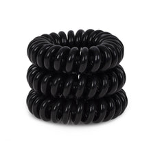Load image into Gallery viewer, A tower of 3 black magic coloured hair bobbles called spirabobble. A black plastic spiral circular hair tie spira bobble.
