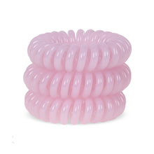 Load image into Gallery viewer, A tower of 3 baby pink coloured hair bobbles called spirabobble. A plastic spiral circular hair tie spira bobble.
