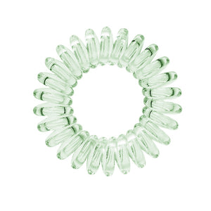 An apple green coloured plastic spiral circular hair bobble on a white background called a spirabobble.