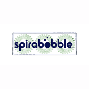 A flat transparent box of 3 apple green coloured hair accessories called spirabobble
