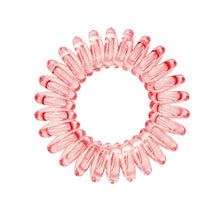 Load image into Gallery viewer, A barely red coloured plastic spiral circular hair bobble on a white background called a spirabobble.
