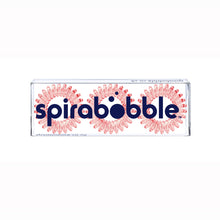 Load image into Gallery viewer, A flat transparent box of 3 barely red coloured hair accessories called spirabobbles
