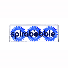 Load image into Gallery viewer, A flat transparent box of 3 transparent clearest blue coloured hair accessories called spirabobbles
