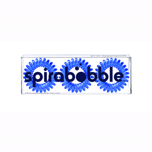 A flat transparent box of 3 transparent clearest blue coloured hair accessories called spirabobbles