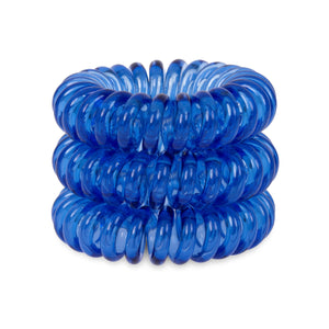 A tower of 3 clearest blue coloured hair bobbles called spirabobbles. A clear blue plastic spiral circular hair tie spira bobble.