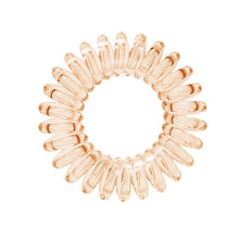 Load image into Gallery viewer, A honey yellow coloured plastic spiral circular hair bobble on a white background called a spirabobble.
