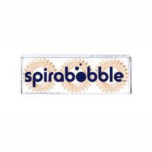 Load image into Gallery viewer, A flat transparent box of 3 honey yellow coloured hair accessories called spirabobbles.
