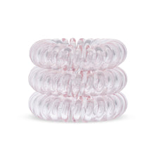 Load image into Gallery viewer, A tower of 3 light pink coloured hair bobbles called spirabobbles. A Pink plastic spiral circular hair tie spira bobble.
