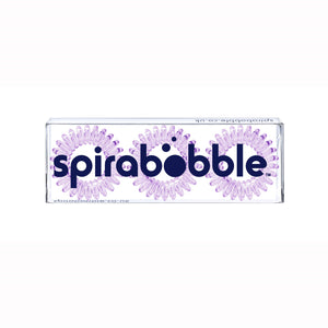 A flat transparent box of 3 light purple coloured hair accessories called spirabobbles