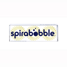 Load image into Gallery viewer, A flat transparent box of 3 light yellow coloured hair accessories called spirabobbles
