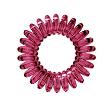 Load image into Gallery viewer, A maroon red coloured plastic spiral circular hair bobble on a white background called a spirabobble.
