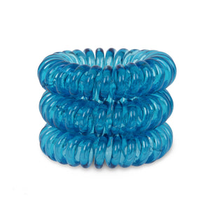 A tower of 3 Mediterranean Blue coloured hair bobbles called spirabobbles. A blue plastic spiral circular hair tie spira bobble.