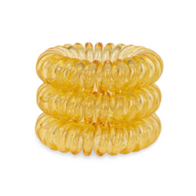 Load image into Gallery viewer, A tower of 3 mellow yellow coloured hair bobbles called spirabobbles. A yellow plastic spiral circular hair tie spira bobble.
