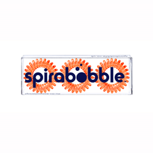 Load image into Gallery viewer, A flat transparent box of 3 orange segment coloured hair accessories called spirabobble
