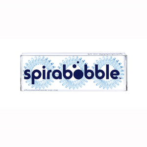 A flat transparent box of 3 pale blue coloured hair accessories called spirabobbles