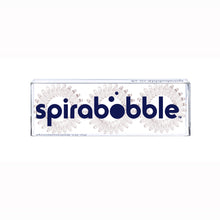 Load image into Gallery viewer, A flat transparent box of 3 pale grey coloured hair accessories called spirabobbles
