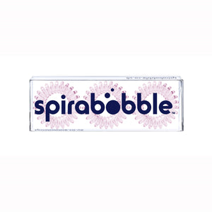 A flat transparent box of 3 perfect pink coloured hair accessories called spirabobbles
