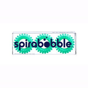 A flat transparent box of 3 pine green coloured hair accessories called spirabobbles